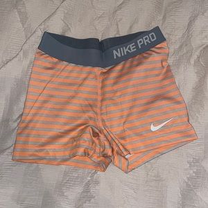 Orange and gray Nike pros